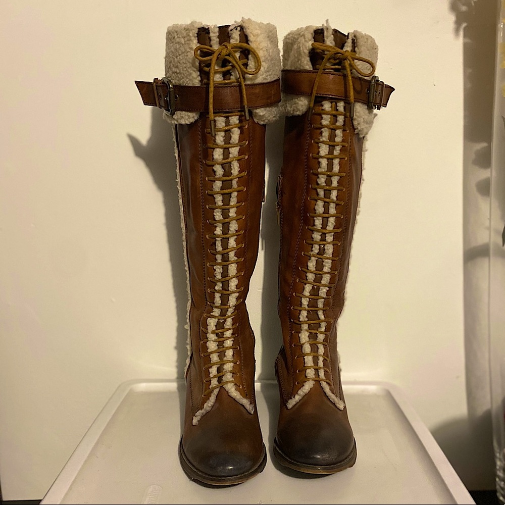 Knee high leather boots.
